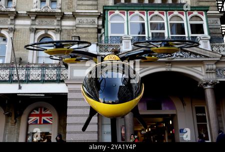 London, Britain. 11th Oct, 2024. A prototype of a flying taxi, which is currently in development in the United Arab Emirates (UAE), is seen on display in the taxi rank outside Charing Cross railway station in London, Britain, Oct. 11, 2024. Credit: Li Ying/Xinhua/Alamy Live News Stock Photo