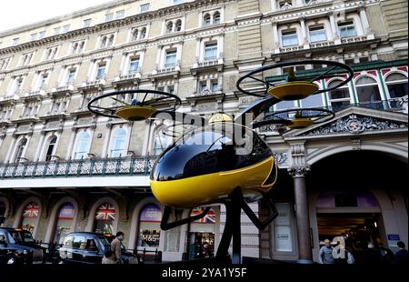 London, Britain. 11th Oct, 2024. A prototype of a flying taxi, which is currently in development in the United Arab Emirates (UAE), is seen on display in the taxi rank outside Charing Cross railway station in London, Britain, Oct. 11, 2024. Credit: Li Ying/Xinhua/Alamy Live News Stock Photo