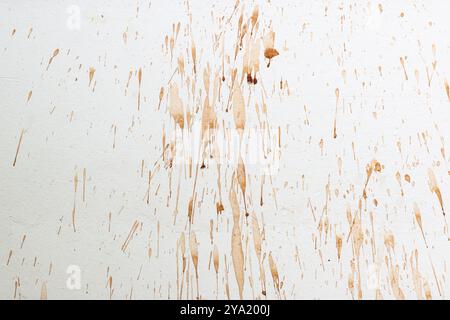 abstract art brown dirty paint design on the ragged white wall. Stock Photo