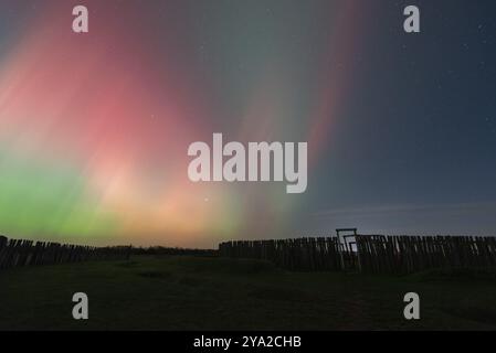 Northern lights (aurora borealis) over the ring sanctuary of Poemmelte, prehistoric circular ditch complex, also known by archaeologists as the German Stock Photo