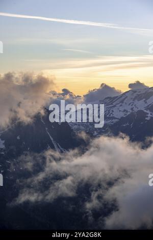 Mountain landscape at sunset, clouds around mountain peaks, Chamonix, Haute-Savoie, France, Europe Stock Photo