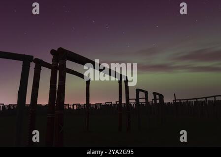 Northern lights (aurora borealis) over the ring sanctuary of Poemmelte, prehistoric circular ditch complex, also known by archaeologists as the German Stock Photo