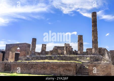 Pompeii in Italy, ruins of the antique Temple of Apollo with bronze Apollo statue, Naples Stock Photo