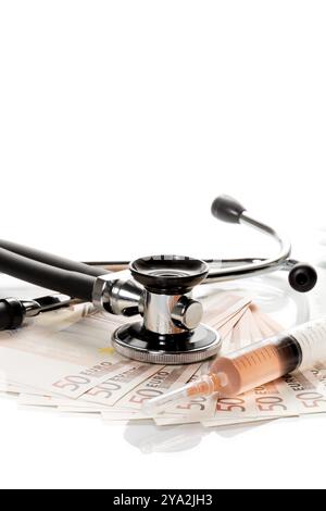Stethoscope and syringe are on 50 euro notes Stock Photo