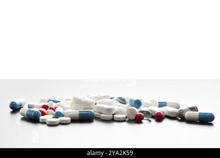 Many colourful tablets on a table, isolated Stock Photo