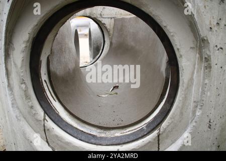 View into a sewage shaft from the perspective of the sewer Stock Photo