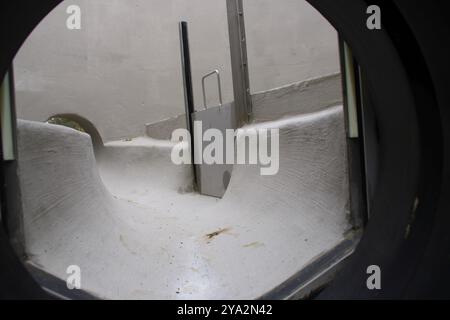 View into a sewage shaft from the perspective of the sewer Stock Photo