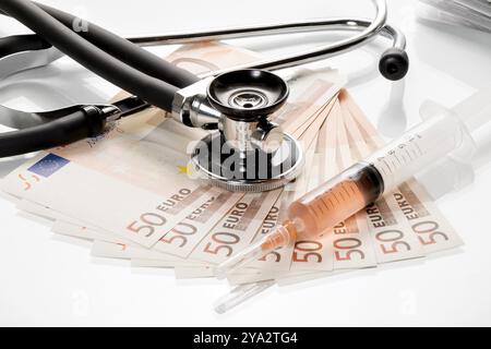 Stethoscope and syringe are on 50 euro notes Stock Photo