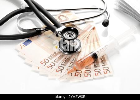 Stethoscope and syringe are on 50 euro notes Stock Photo