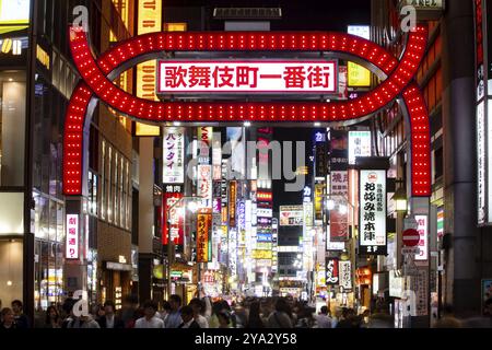 Shinjuku, Japan, 18 May 2019: Neon signs illuminate Tokyo?s busy Shinjuku neighborhood with crowds of people at night, Asia Stock Photo