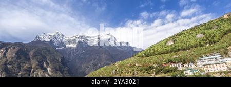 Namche Bazaar village on the way to Everest Base. Nepal. Asia. Web banner in panoramic view Stock Photo