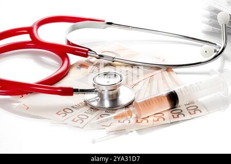 Stethoscope and syringe are on 50 euro notes Stock Photo