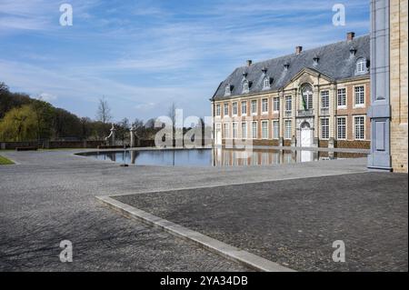 Averbode, Laakdal, Belgium, April 21, 2023, The building of the historical abbey reflecting in the water, Europe Stock Photo