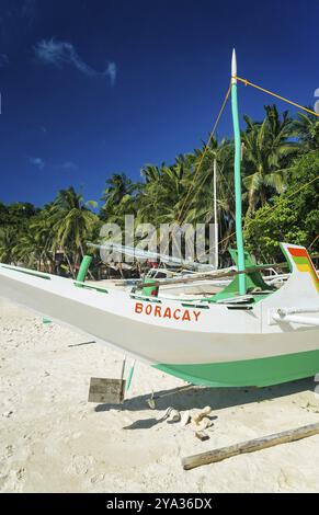 Traditional fishing boat on puka beach in tropical paradise boracay philippines Stock Photo