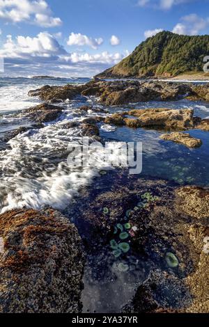 This is a color landscape photo of a vivid sunset over the Pacific Ocean Stock Photo