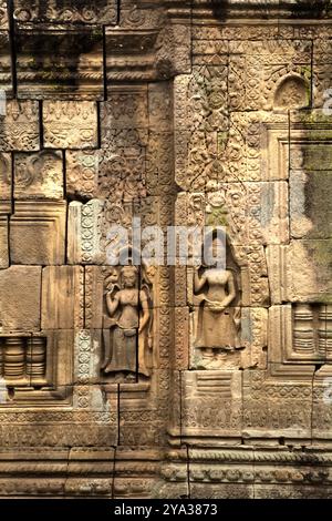 Relief of apsara figures on the wall of Banteay Prei Nokor, an ancient temple in Kampong Cham, Cambodia. Stock Photo