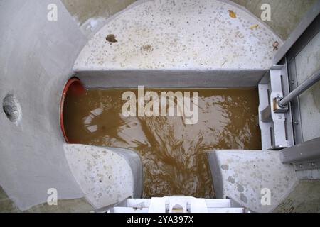 View from above into a sewage shaft Stock Photo