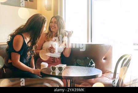 Women, friends and bonding with talking, laughing or chat in cafe on weekend, holiday or trip. Female people, together and happiness in bokeh Stock Photo