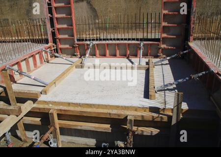 Formwork of a concrete wall was secured against slipping with struts Stock Photo