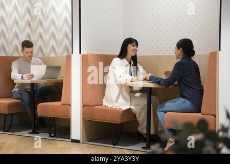 Diverse entrepreneurs, freelancers working in shared office Stock Photo