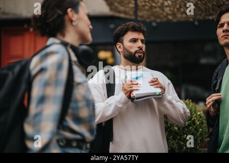 Group of college students engaged in outdoor discussion Stock Photo