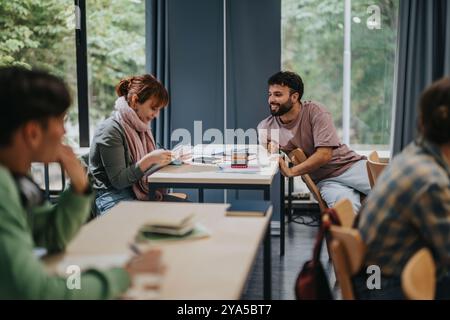 Students engaging with professor in a collaborative classroom setting Stock Photo