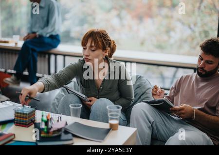 Professor engaging with attentive students in a study session Stock Photo