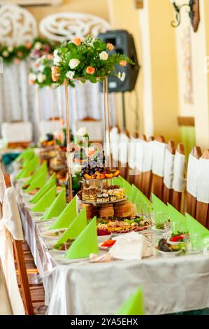 Elegant Banquet Table Set for a Grand Celebration with Floral Decor. Stock Photo