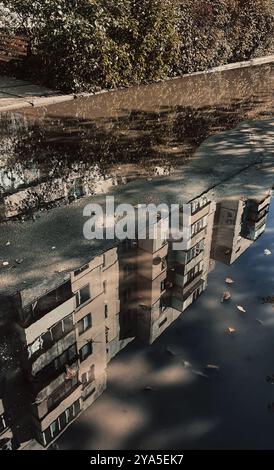 Reflection of a house in a puddle Stock Photo