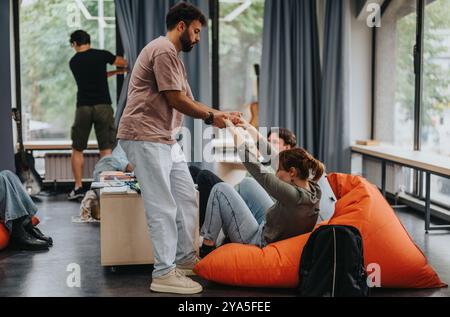 Engaging professor interacting with students in modern classroom setting Stock Photo