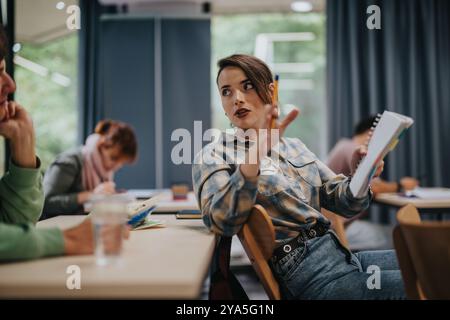 Students attentively engaging in a cozy classroom discussion Stock Photo