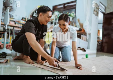 male asian production crew amazed by the beautify of the female crew Stock Photo