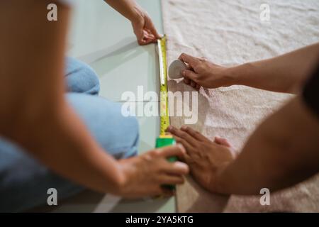hands of couple production crew marking the fabric Stock Photo