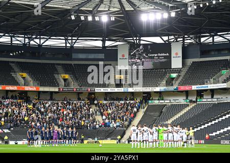 MK Dons, UK, 12th October 2024. Clubs and fans pay tribute to former player George Baldock who sadly passed away early in the week. A minutes silence was held ahead of the EFL League Two tie between MK Dons and Port Vale Credit: TeeGeePix/Alamy Live News Stock Photo