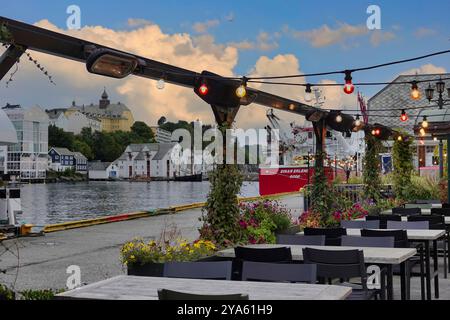 lesund, Norwegian Sea,  Norway 10th September, 2024  Empty cafe/bar on harbourside in the Art Nouveau town of lesund Stock Photo