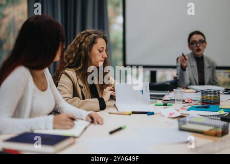 Students participating in a collaborative learning classroom environment Stock Photo
