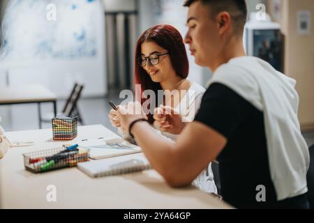 Students collaborating creatively in a modern study environment Stock Photo