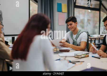 High school students collaborating in a bright classroom Stock Photo