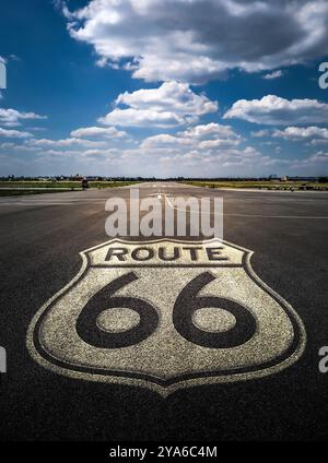 Route 66 road sign painted on asphalt Stock Photo