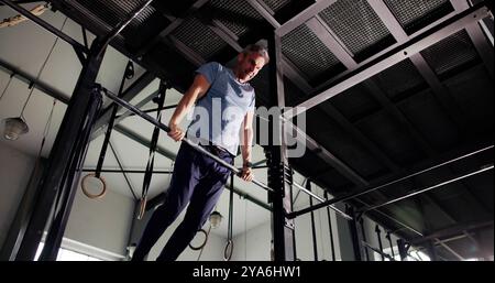 Strong Man Doing Muscle Up Calisthenics Workout Training Stock Photo