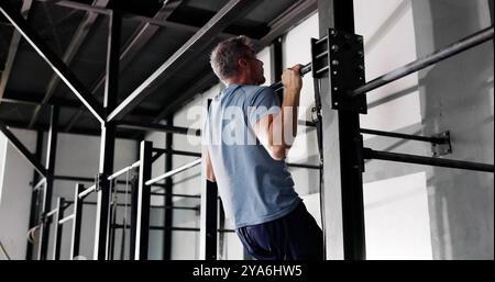 Strong Young Man Doing Pull Up Workout Training Stock Photo