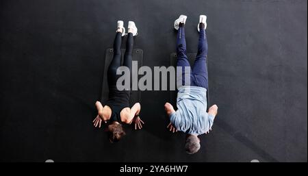Active Couple Doing Pilates Workout In Gym Stock Photo