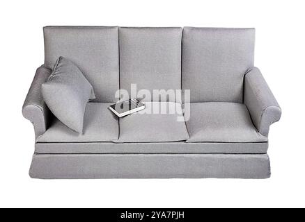 Plain off white couch ready to decorate with a book on the cushion Stock Photo