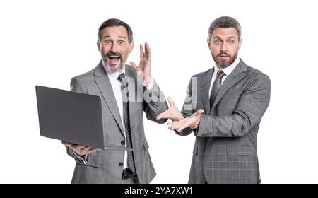 photo of amazed businessmen freelancer with laptop. two businessmen freelancer using laptop. Stock Photo