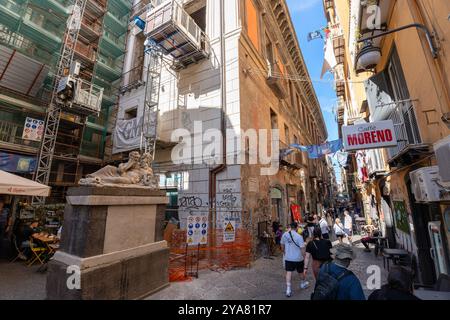 Naples, Italy - May 23, 2024: Charming Pedestrian Street in Naples: Cafes and Reconstruction. Stock Photo