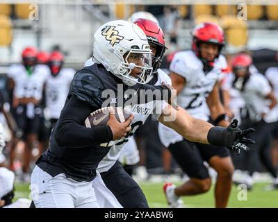 Orlando, FL, USA. 12th Oct, 2024. UCF Knights quarterback Jacurri Brown (11) during NCAA football game between the Cincinnati Bearcats and the UCF Knights at FBC Mortgage Stadium in Orlando, FL. Romeo T Guzman/CSM/Alamy Live News Stock Photo