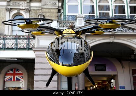 Beijing, Britain. 11th Oct, 2024. A prototype of a flying taxi, which is currently in development in the United Arab Emirates (UAE), is seen on display in the taxi rank outside Charing Cross railway station in London, Britain, Oct. 11, 2024. Credit: Li Ying/Xinhua/Alamy Live News Stock Photo