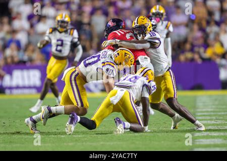 Mississippi running back Ulysses Bentley IV (24) runs the ball pursued ...