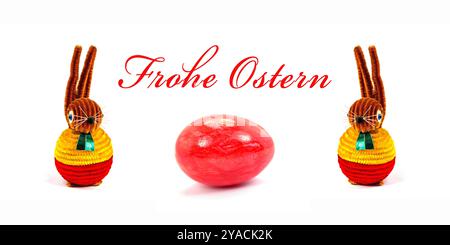 Two Easter bunnies and an egg with the words “Happy Easter” against a white background Stock Photo