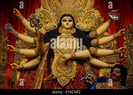 Idol of Goddess Devi Durga at a decorated puja pandal in Kolkata, West Bengal, India. Durga Puja is a popular and major religious festival of Hinduism Stock Photo